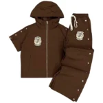 Saint Vanity brown hooded tracksuit set featuring a jacket with side snaps and matching snap-button lounge pants.
